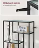 Close-up of a black metal shelf unit with glass shelves, showing a detail of how it attaches to the wall and decorative items on the shelves. Produktbild-Vorschau