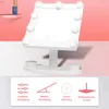 A white makeup mirror with LED lights is shown on a stand, with icons and text describing its features below. Produktbild-Vorschau