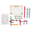 A collection of colorful wooden bird toys and an instruction sheet laid out on a white background. Náhled obrázku produktu
