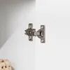 A close-up view of a metal hinge attached to a white surface. Anteprima dell’immagine prodotto
