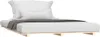 A bed with pillows and a blanket on a wooden pallet base, isolated on a white background. Náhľad obrázku produktu