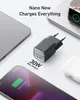 A collection of Anker charging devices, including a smartphone, charger, and earbuds, are displayed on a white and light gray surface. Anteprima dell’immagine prodotto