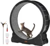 A cat is running on a large black cat wheel, with accessories like a feather wand, screwdriver, and gloves laid out next to it. Náhľad obrázku produktu