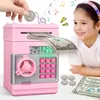 A young girl is looking at a pink electronic piggy bank that is accepting a dollar bill. There are coins and dollar bills on the table. Náhľad obrázku produktu
