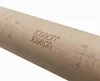 A close-up shot of a wooden rolling pin with engraved branding and measurement markings. Produktbild-Vorschau