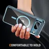 A hand holding a clear phone case with a magnetic ring inside, against a dark background. Náhled obrázku produktu