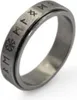 A close-up studio shot of a silver ring with engraved runes. Náhled obrázku produktu