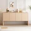 A modern sideboard with decorative doors is displayed in a well-lit room, adorned with a framed artwork and various kitchen appliances and bottles on its surface. Anteprima dell’immagine prodotto