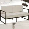 A cream-colored outdoor sofa with a dark brown frame, shown with water droplets on a textured background and a close-up of a zipper. Náhled obrázku produktu