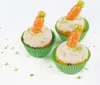 Three carrot-themed cupcakes decorated with white icing and green sprinkles, each topped with a marzipan carrot. Náhľad obrázku produktu