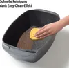 A hand is cleaning a dirty pot with a sponge, demonstrating the easy-clean effect. Produktbild-Vorschau