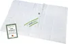 A white quilted blanket is laid out on a white surface. Produktbild-Vorschau