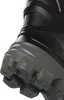 A close-up view of the sole and lower part of a black and gray boot. Produktbild-Vorschau