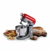 A red and silver stand mixer is shown with various baked goods and pasta. Podgląd zdjęcia produktu