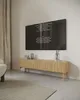 A modern living room with a TV stand and a TV displaying credits. Náhled obrázku produktu