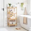 A bathroom scene with a wooden shelf unit filled with toiletries and towels next to a bathtub. Produktbild-Vorschau