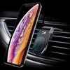 A smartphone is mounted on a car's air vent using a magnetic holder. Voir les images du produit