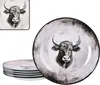 A stack of plates with a bull's head design, and a single plate in the foreground. Voir les images du produit