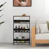A black and brown rolling cart with four shelves is placed next to a light-colored sofa in a room. Produktbild-Vorschau
