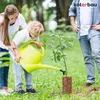 A family is planting a tree in a garden. Produktbild-Vorschau