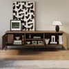 A modern living room setting with a wooden TV cabinet filled with decorative items and books. Anteprima dell’immagine prodotto