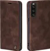 A brown leather flip case for a smartphone is shown from two angles. Produktbild-Vorschau