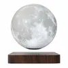 A levitating moon lamp on a wooden base against a white background. Náhled obrázku produktu