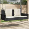 A black rattan swing bench with cream cushions is shown outdoors, suspended by chains. Náhľad obrázku produktu