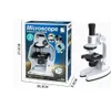 A product box for a children's microscope and the microscope itself are shown. Voir les images du produit