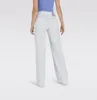 A person wearing white wide-leg jeans and a blue top, shown from the back. Produktbild-Vorschau