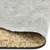 A close-up view of a roll of gravel sheeting, showing the textured fabric and the embedded stones. Náhľad obrázku produktu