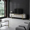 A modern living room with a TV stand, coffee table, and armchair. Voir les images du produit