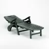 A dark green plastic sun lounger on a white background. Anteprima dell’immagine prodotto