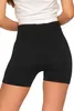 A close-up view of a woman wearing black high-waisted ribbed seamless sports leggings. Produktbild-Vorschau