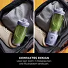 A portable blender filled with a green smoothie is placed inside a gym bag next to a pair of sneakers. The image is split into two halves, showing the blender from slightly different angles. Náhled obrázku produktu