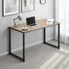 A modern desk with a laptop, coffee cup, and lamp. Produktbild-Vorschau