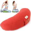 A collage showing two women practicing yoga poses on green cushions, and a large red half-moon shaped yoga bolster in the foreground. Produktbild-Vorschau