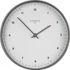 A close-up view of a white analog wall clock with a gray frame and hands. Anteprima dell’immagine prodotto