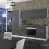 A modern kitchen setup with a city skyline view at dusk. Voir les images du produit