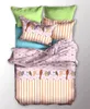 A top-down view of a neatly made bed with bedding featuring a bird pattern. Produktbild-Vorschau