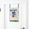 A rectangular mirror with a gold frame hangs on a white door. The mirror reflects abstract art and a green cushion. Náhled obrázku produktu