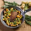 A close-up of a pan with duck breast, potatoes, and asparagus, garnished with rosemary. Náhľad obrázku produktu