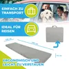 A graphic overlay with text and icons is placed over a lifestyle image of a family and their dog in a car, and a product shot of a folded mattress. Produktbild-Vorschau