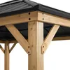 A close-up view of the wooden frame and black metal roof of a gazebo. Náhled obrázku produktu