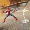 A Spider-Man action figure is posed on a rooftop, shooting a web. Podgląd zdjęcia produktu