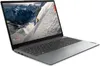 A gray Lenovo IdeaPad laptop is shown from a diagonal angle, open with the screen displaying a mountain skiing scene. The laptop is on a white background. Produktbild-Vorschau