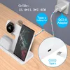 A white wireless charging station with a phone, smartwatch, and earbuds is shown on a wooden desk. Produktbild-Vorschau