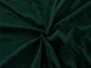 A close-up, top-down view of a crumpled dark green microfiber fabric, likely a bedsheet, with soft folds and shadows. Náhled obrázku produktu