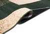 A close-up, rolled-up corner of a rug with a geometric pattern. Anteprima dell’immagine prodotto