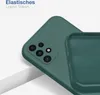 A close-up view of a dark green phone case, showing the camera cutout and the interior texture of the case. Produktbild-Vorschau